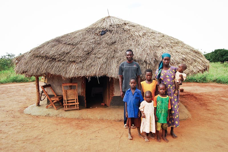 uganda-family-outside-small-home.jpg